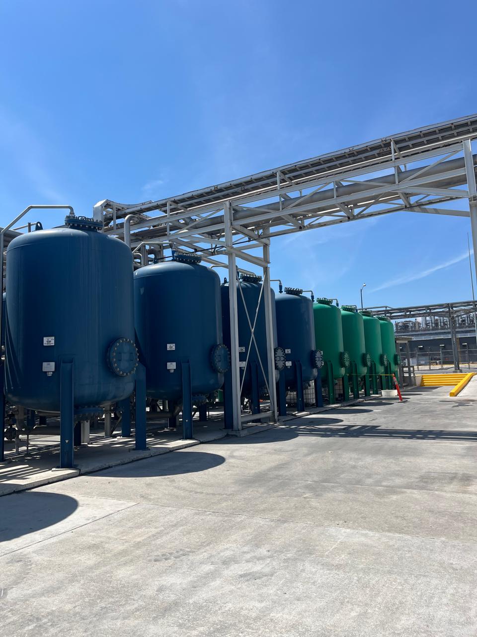 a bunch of water filters posed outside